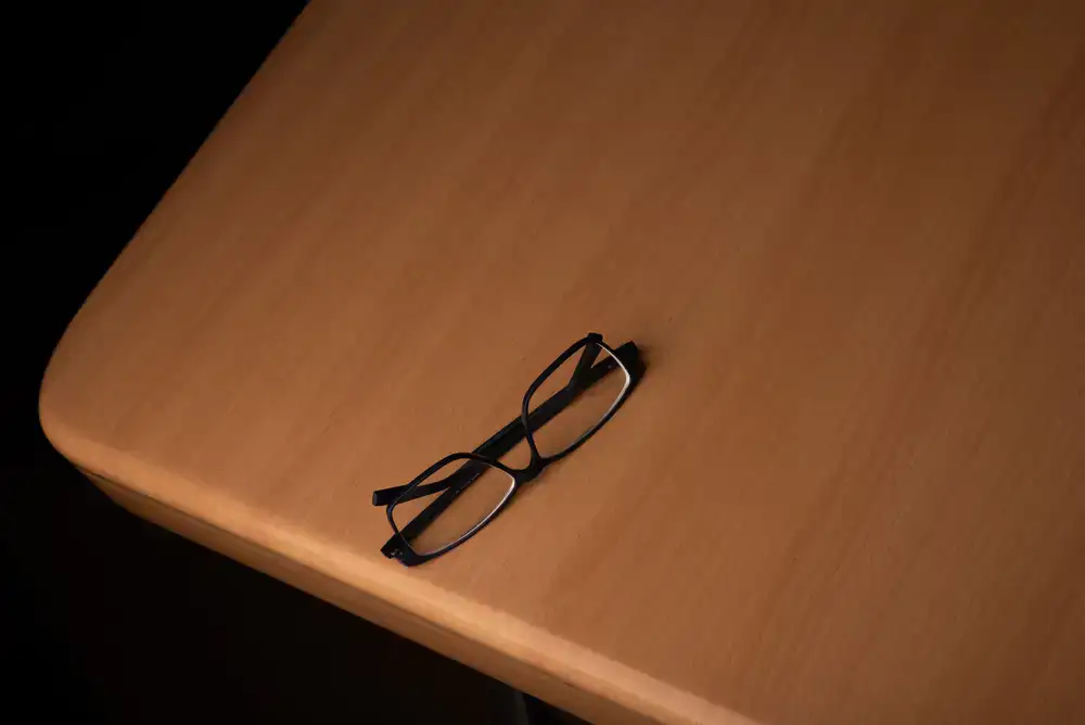Close up of fine reading glasses on a table