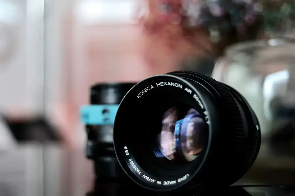 Macro shot of a lens reflecting soft light to demonstrate anti-reflective coating