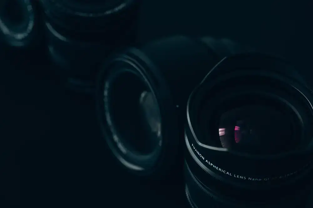 Close up of a precision lens fitting tool and high quality lenses