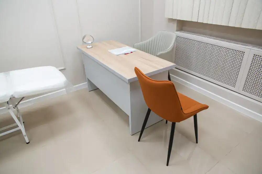 Clean, bright optician salon interior focusing on the consultation desk